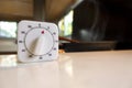 White cooking timer countdown on the white table in the asia modern kitchen