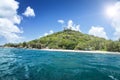 White coral sand on tropical beach. La Digue island, Seyshelles. Royalty Free Stock Photo