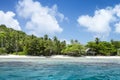 White coral sand on tropical beach. Mahe island, Seyshelles. Royalty Free Stock Photo