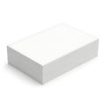 A white corrugated cardboard box with a textured surface sits on a white background Royalty Free Stock Photo