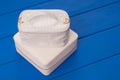 White cosmetic bags are on blue table, make-up bag, Royalty Free Stock Photo