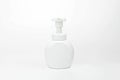 White cosmetic bottle dispenser pump with tube container from front angle isolated.