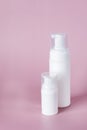 White cosmetic bottle mockup on pink background. Minimalist product still life Beauty blogging Cosmetic background Hygiene, skin