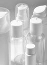 White cosmetic bottles on white background. Wellness, spa and body care bottles collection. Beauty treatment