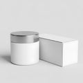 White cosmetic container and box on a gray background Royalty Free Stock Photo