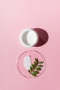 White cosmetic cream strokes on pink background. Skincare lotion face serum smear. Beauty product texture. White jar of face or