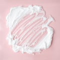 White cosmetic foam texture on pink on pink background. Cosmetic mousse, cleanser, shaving foam, shampoo. Foamy skin care product Royalty Free Stock Photo