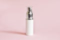 White cosmetic products tube. Blank plastic container for cream, lotion, toothpaste, nourishing or moisturizing mask on a pink bac Royalty Free Stock Photo