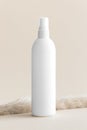 White cosmetic spray bottle mockup on the soft yellow background