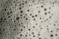 White cosmetics foam texture on black background. Cleanser, shampoo bubbles, wash - liquid soap, shower gel, shampoo Royalty Free Stock Photo