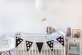 White cot with decoration