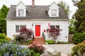 White Cottage with Red Door in Canada