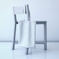 White cotton bag hanging on a chair. 3d rendering Royalty Free Stock Photo