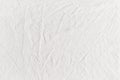 White cotton canvas fabric texture with creases. Royalty Free Stock Photo