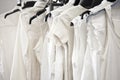 White cotton ladies tops on hangers