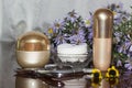 Cotton swabs, cream and nail accessories on a polished table