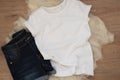 White cotton T-shirt and denim shorts mockup. Woman shirt mock ups. Blank clothes template mock up. Flat lay styled stock photo