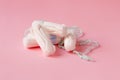 Cotton tampons on pink background