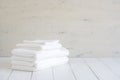 White cotton towels use in spa bathroom on wood background. Royalty Free Stock Photo