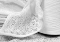 white cotton yarn in bobbins and openwork fabric made from this yarn Royalty Free Stock Photo