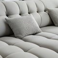 A white couch with a black and white pillow on it Royalty Free Stock Photo