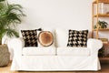 White couch with decorative pillows