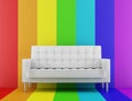 White couch in front of multicolored wall