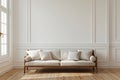 A white couch is positioned in a living room, situated next to a window. Monochrome interior for mockup, wall art