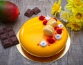 Mango Cake with Chocolate, Mango and Passion Fruit Mousse, with Crunchy Almond Layer