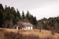 a white country house on a hill near a forest Royalty Free Stock Photo