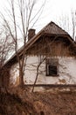 a white country house on a hill near a forest Royalty Free Stock Photo