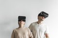 White couple experiencing virtual reality with VR headset