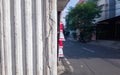 White cracked column wall with blurry background