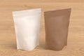 White and craft packaging pouches mockup for tea, coffee, snack on wooden background Royalty Free Stock Photo