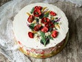 White cream cake decorated with buttercream flowers, Poppies, chamomile, cornflowers, spikelets of wheat, on gray background. Royalty Free Stock Photo