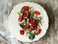 White cream cake decorated with buttercream flowers, Poppies, chamomile, cornflowers, spikelets of wheat, on gray background. Royalty Free Stock Photo