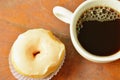 white cream donuts and black coffee cup on wooden board Royalty Free Stock Photo