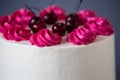 White Cream Icing Cake with Fruits, on blue background Royalty Free Stock Photo