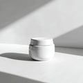 White Cream Jar in Sunlight Royalty Free Stock Photo