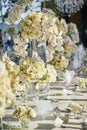 The white cream roses, orchids decoration on the reception dinner table, flowers, Floral - closed up Royalty Free Stock Photo