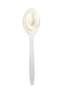 White cream in spoon, sour cream, mayonnaise or yogurt, dairy products