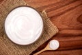 White creamy homemade yogurt on the wooden table , top view or o