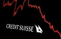 White Credit Suisse logo on a stock market performance chart trend Royalty Free Stock Photo