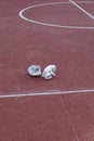 White cricket gloves left on the pitch