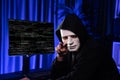 White criminal anonymous mask pointing to camera, provoke as hacker. Surmise.
