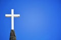 White Cross Church Steeple Blue Background