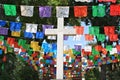 White cross with colorful flags, Mexico