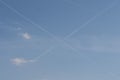 White cross lines on blue sky Royalty Free Stock Photo