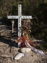 Cross with ornaments in Australian bushland