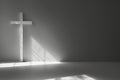 a white cross, with shadow, on a grey background